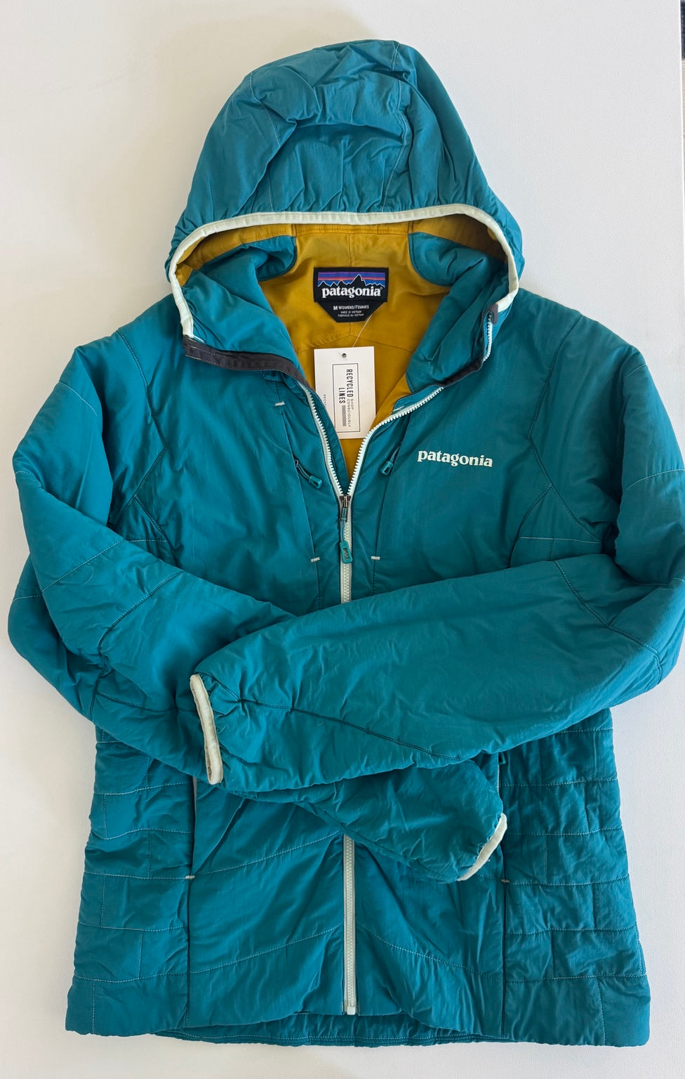 Patagonia teal insulated hooded jacket with yellow lining women's size M