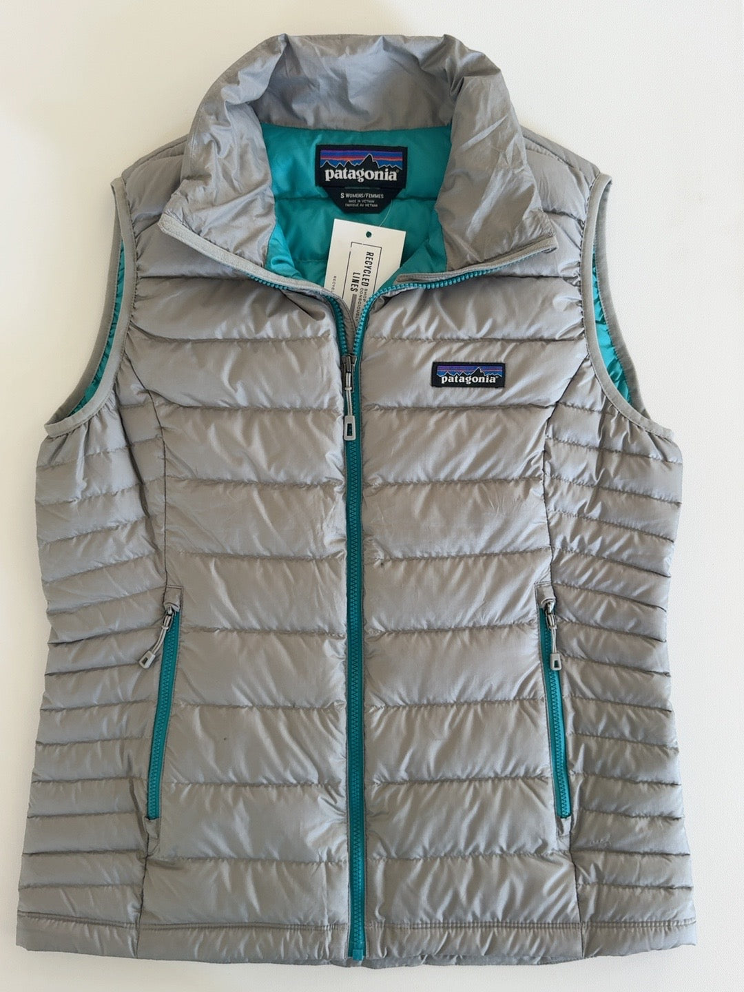 Patagonia gray quilted puffer vest with teal lining and zippers women's size S