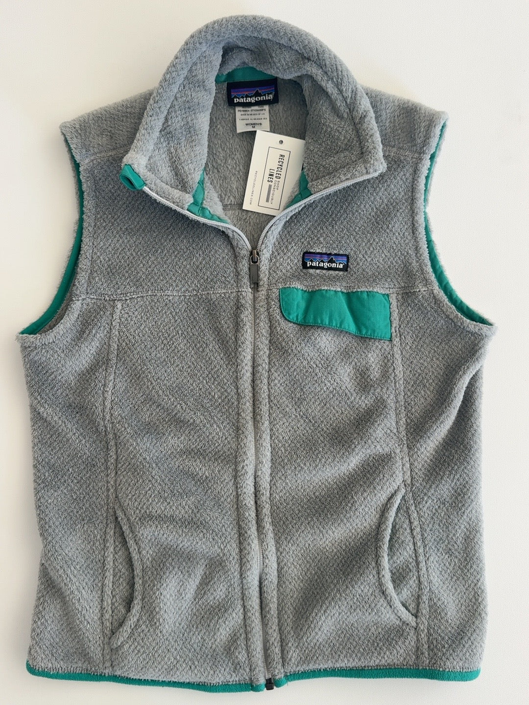 Patagonia gray fleece vest with teal trim women's size M
