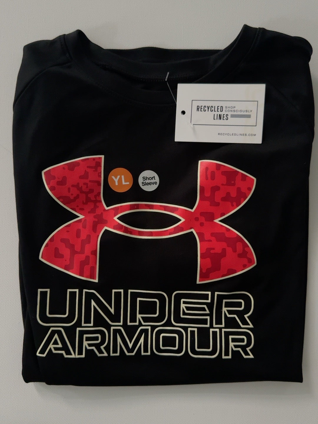 Under Armour black boys size L short sleeve tee with red camouflage logo