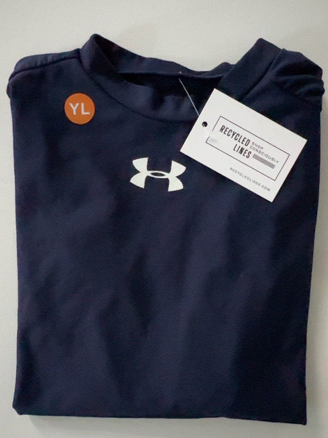 Under Armour navy boys size L long sleeve tee with white logo