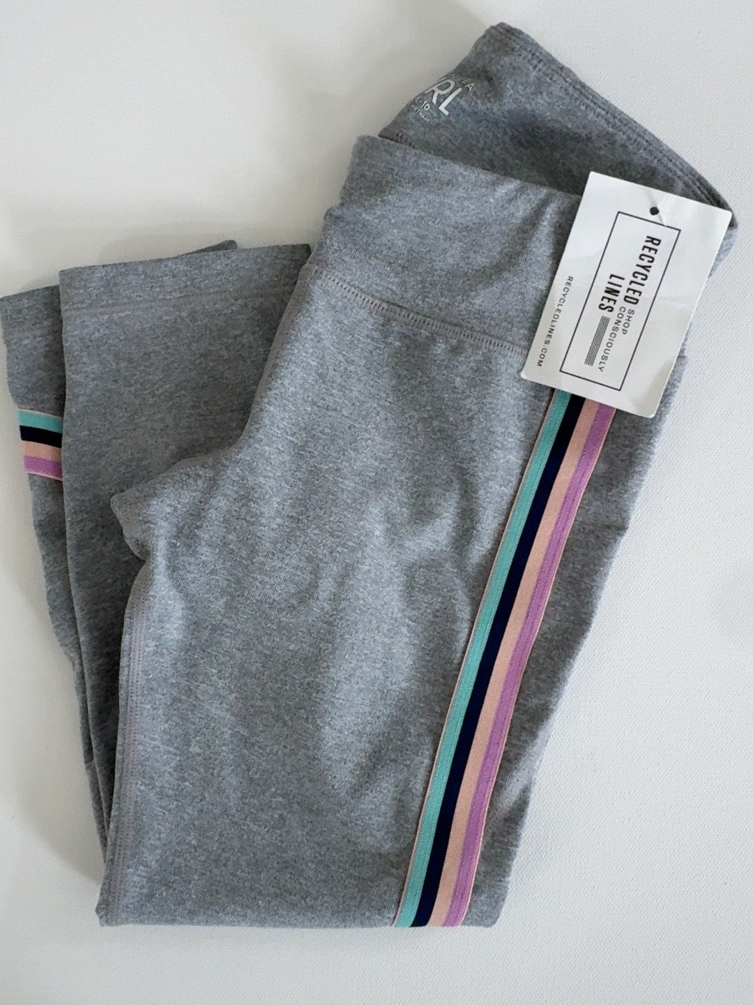 Athleta Girl gray leggings with multicolor side stripes, girls size M (8/10)