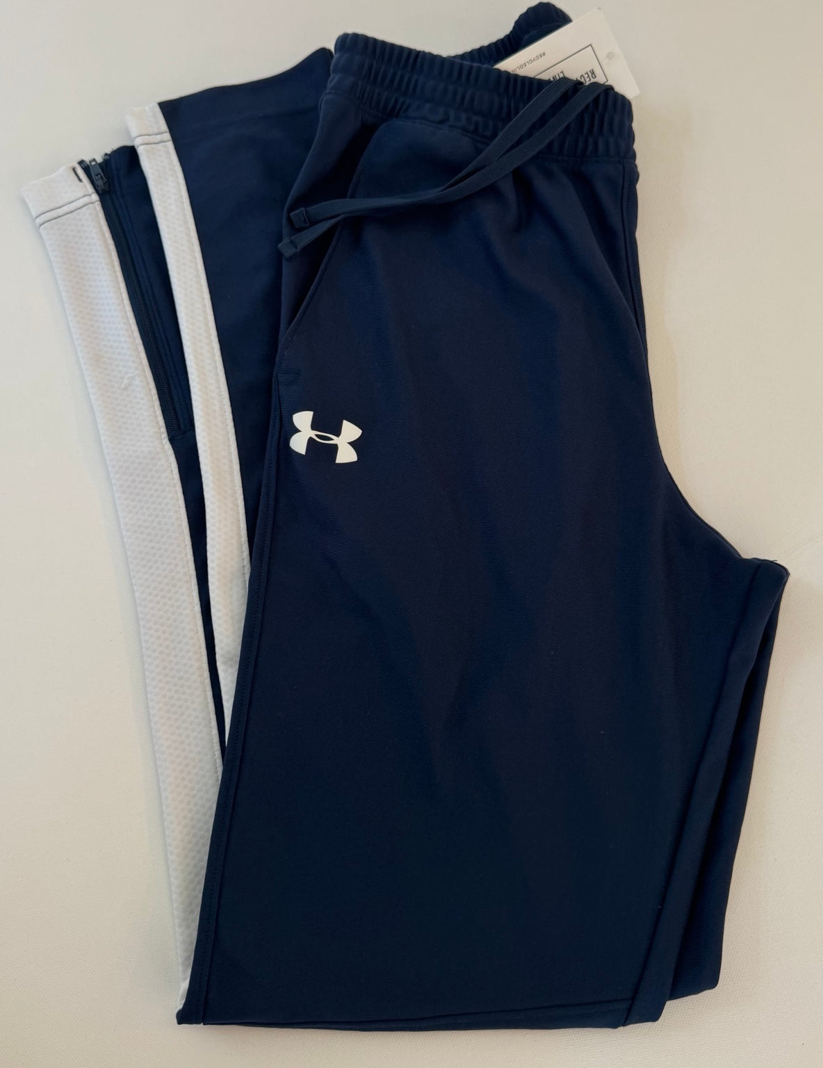 Under Armour navy men's size small athletic pants with white side panels, item P2989