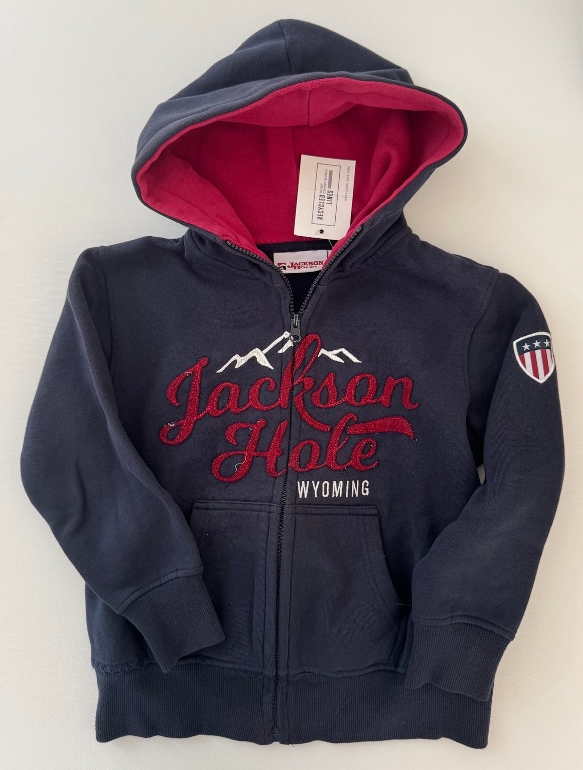 Jackson Hole navy zip-up hoodie with red lining, boys size small