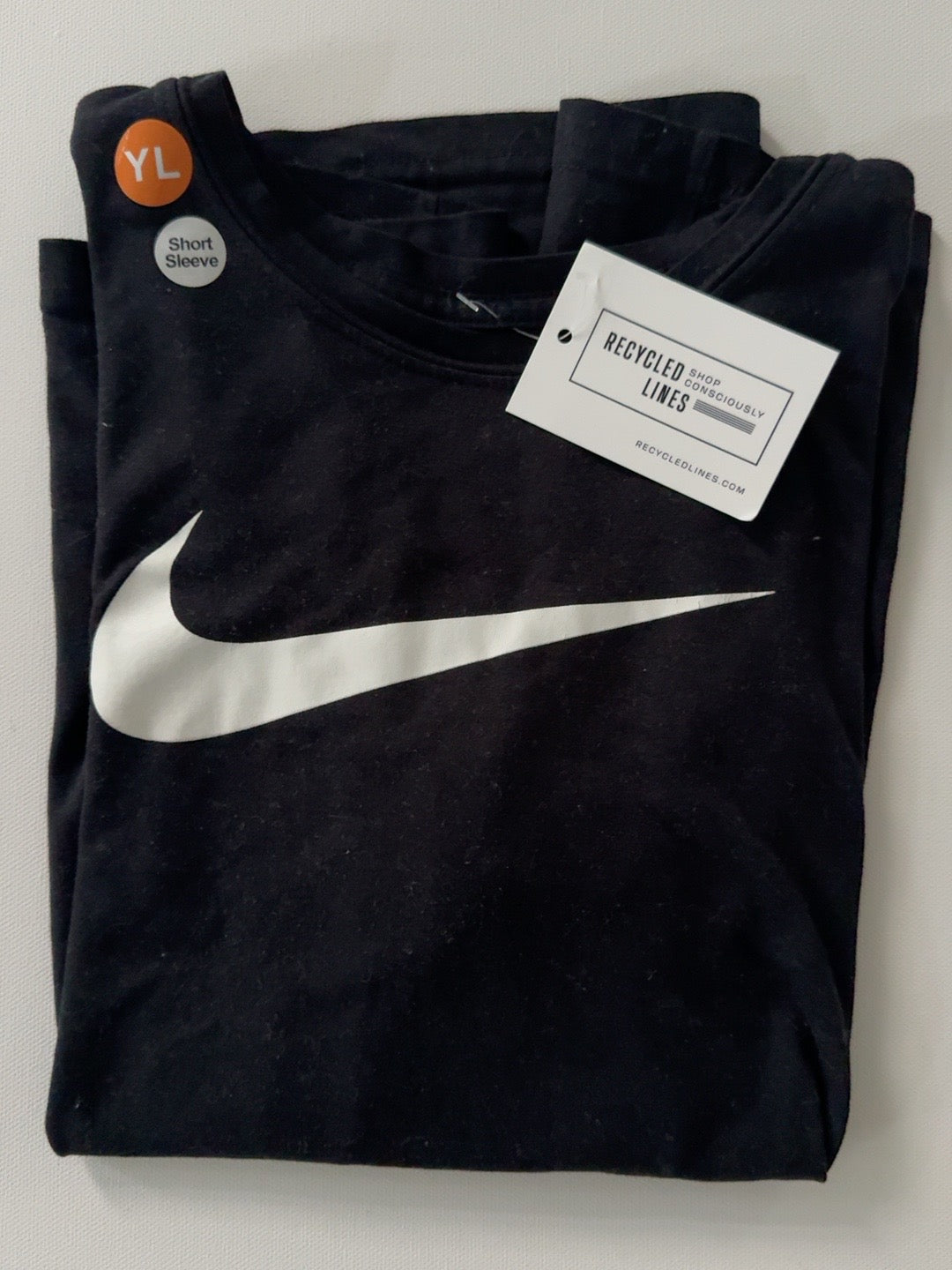 Nike black short sleeve boys size L tee with white swoosh