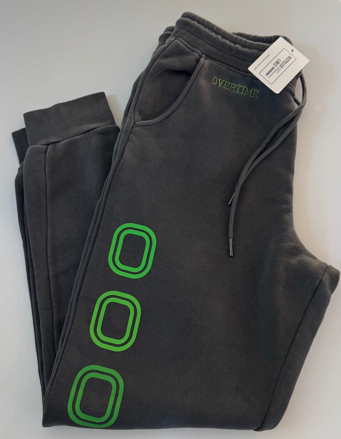 Overtime gray men's size small sweatpants with green lettering, item P9593
